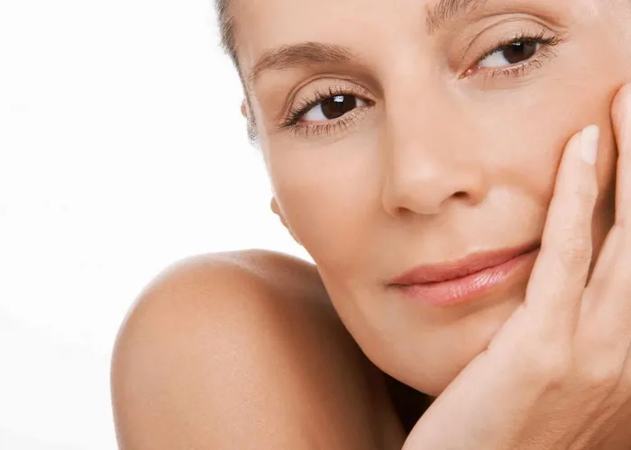 woman looking relaxed with her head in her hand